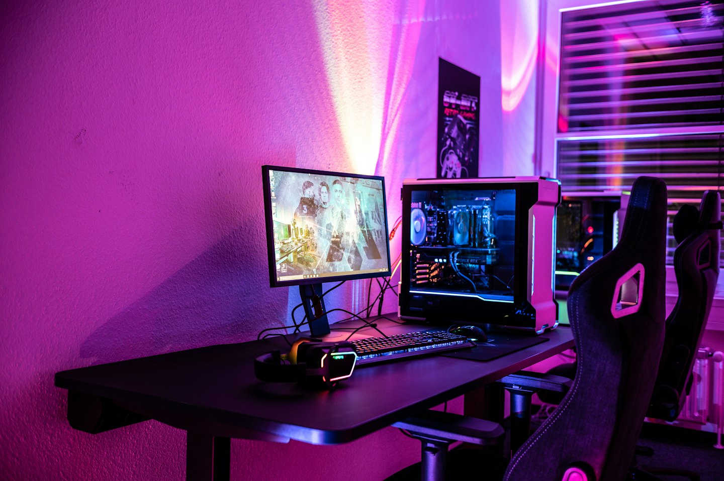 Desktop computer setup with glowing RGB lights on a desk.