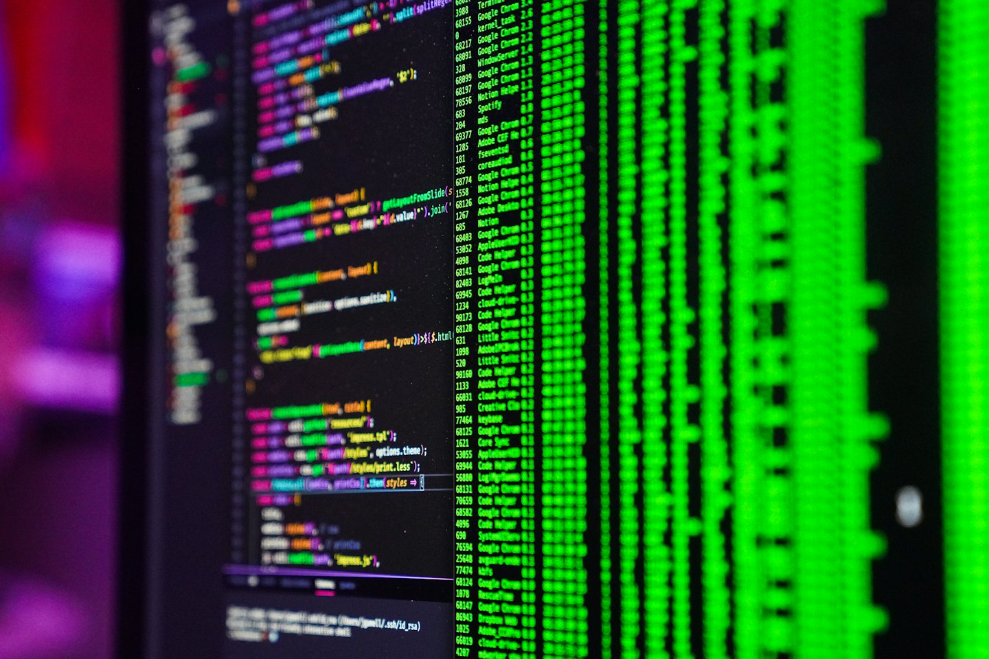 Computer monitor displaying lines of colorful programming code.